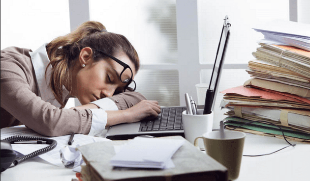 woman taking a nap while working