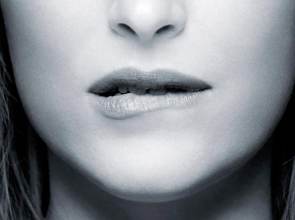 woman biting lower lip