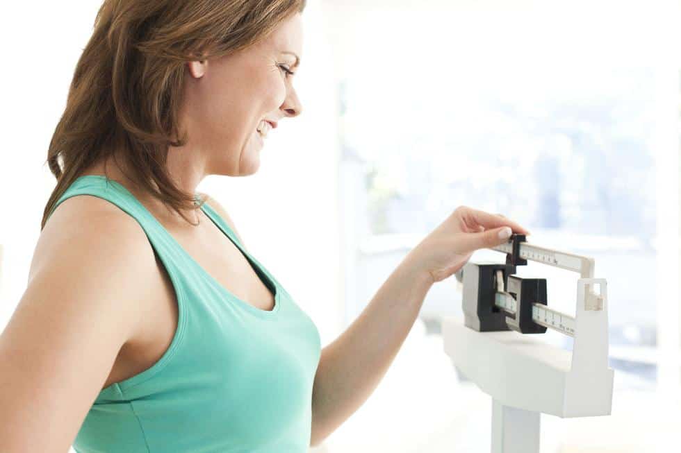 woman weighing herself