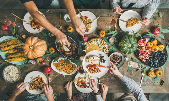 group of people eating together in a table