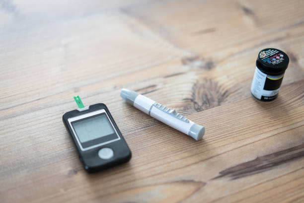 Blood-Sugar-Control-001-03-1 Electronic Glucose Meter On The Wood Table