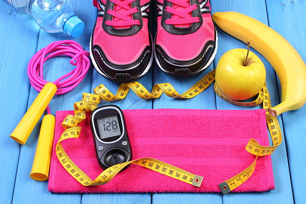 Blood-Sugar-Friendly-Fitness-Routine-001 Glucose meter with result of sugar level, sport shoes, fresh fruits and accessories for fitness or sport, healthy and active lifestyles, copy space for text
