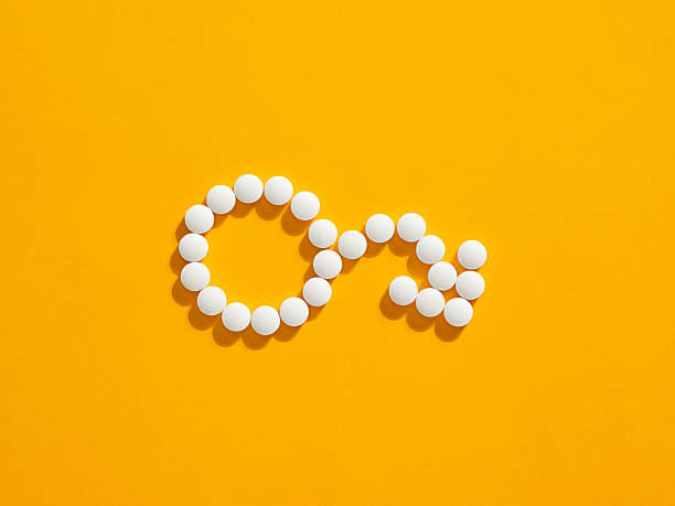 Erectile-Dysfunction-001-01-1 White pills forming male gender symbol representing impotency, erectile dysfunction, fertility or libido treatment and sexual health issues