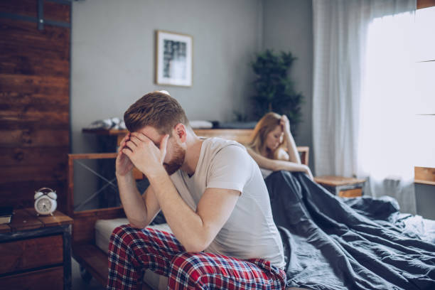 Couple having arguments and sexual problems in bed