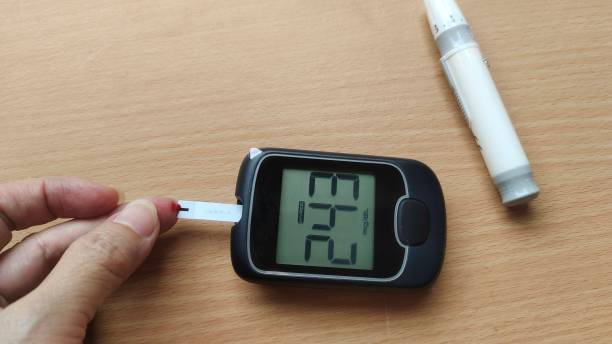 Portrait showing diabetes patient woman checking fingertip, showing level high blood sugar on pressure monitor, patient take proactive control, concept health care.
