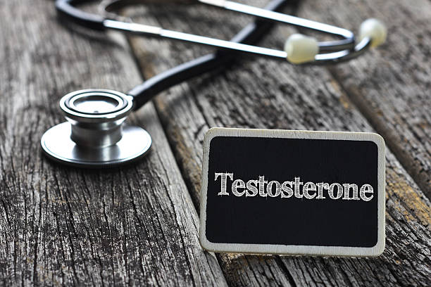 Medical Concept- Testosterone word written on blackboard with Stethoscope on wood background