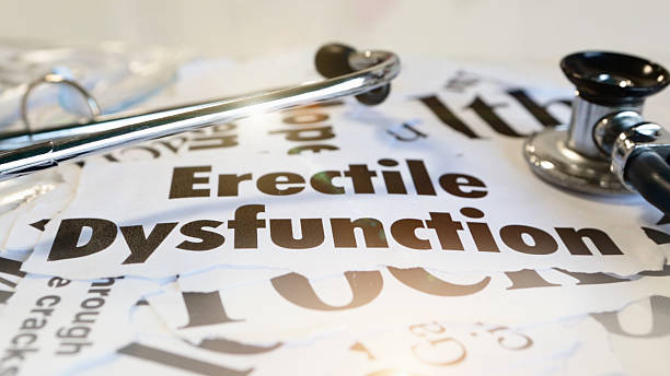 Press headlines and printouts about " Erectile Dysfunction" with a stethoscope.
