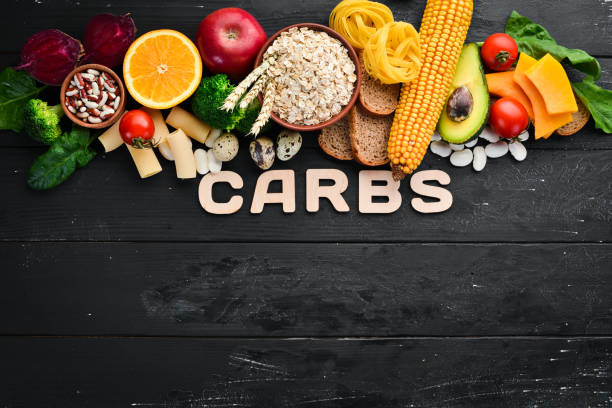 Foods high in carbohydrates: bread, pasta, avocado, flour, pumpkin, broccoli, beans, spinach. The concept of healthy eating.