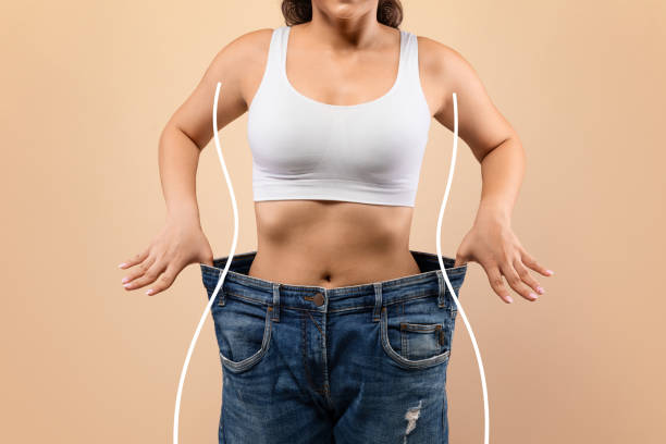 Weight Loss. Young Slim Female Pulling Big Jeans And Showing Result Of Weight Loss With Drawn Silhouette Outlines, Unrecognizable Sporty Woman In Oversized Clothes Demonstrating Body After Slimming