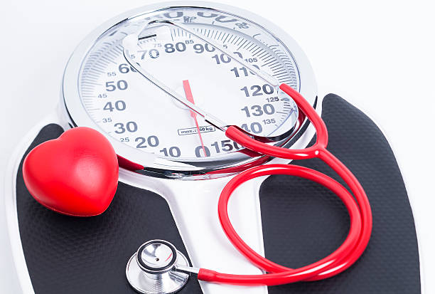 Image shows an analog bathroom scales with a stethoscope