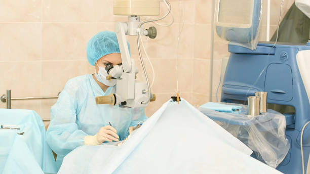 Ophthalmology laser microscope operation. Doctor in clinic. Patient eye treatment. Myopia and cataract removal.