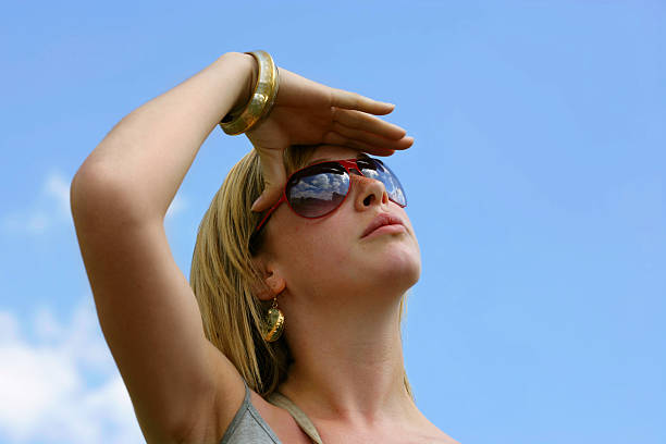 A beautiful young girl watching the sky, seeming to see the future...