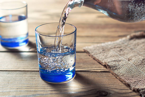 Glasses of water on a wooden table. Water was poured into the beaker.