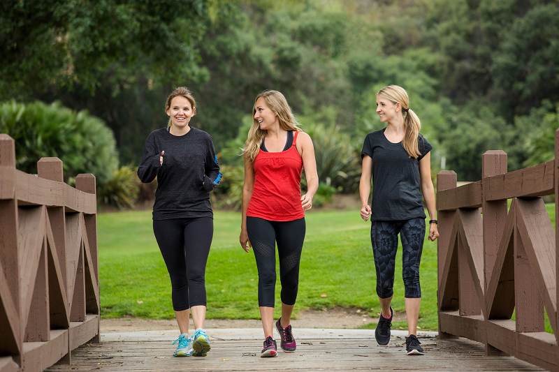 Person walking outdoors as part of a daily exercise routine. Habits
